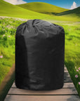 Black Insulated Pump Cover On a Wooden Bench In a Field; Perfect For Hot Tubs